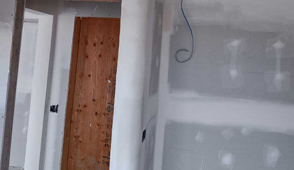 Drywall around corner near doorway